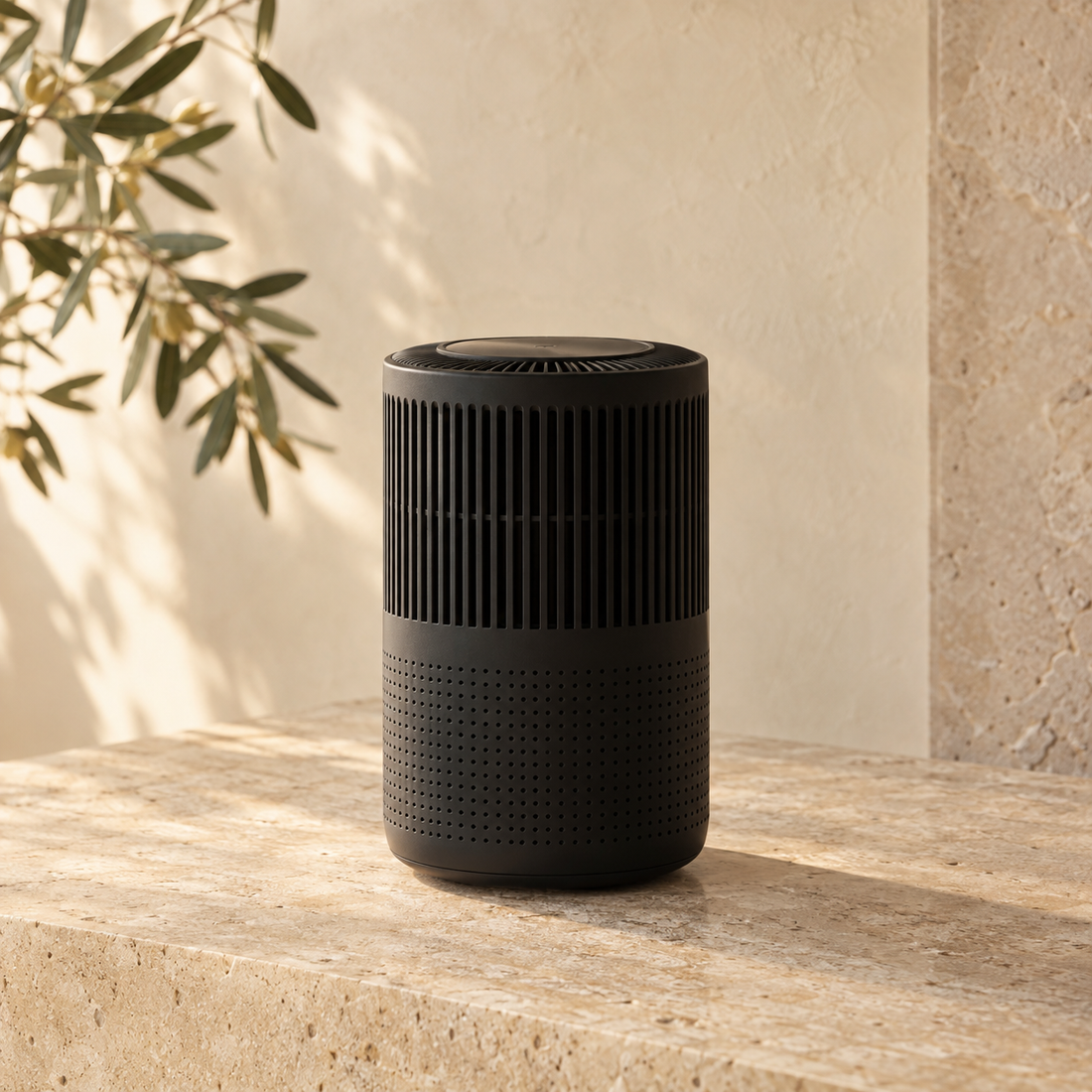 Black air purifier on a warm stone surface